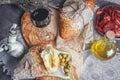 A glass of dry red wine and Italian Focaccia bread with cheese and olive oil and sun dried tomatoes. Selective focus. Royalty Free Stock Photo