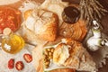 A glass of dry red wine and Italian Focaccia bread with cheese and olive oil and sun dried tomatoes. Selective focus. Royalty Free Stock Photo