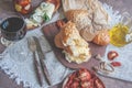 A glass of dry red wine and Italian Focaccia bread with cheese and olive oil and sun dried tomatoes. Selective focus. The Royalty Free Stock Photo