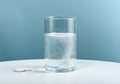 Glass with effervescent aspirin tablet Royalty Free Stock Photo