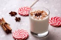 Glass of eggnog and candy cane Royalty Free Stock Photo