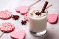 Glass of eggnog and candy cane Royalty Free Stock Photo