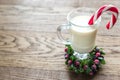 A glass of eggnog with candy cane Royalty Free Stock Photo