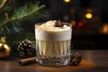 Glass of eggnog covered with layer of whipped cream. Traditional Christmas drink is decorated with cinnamon sticks