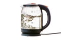 Glass electric kettle with boiling water on a white insulated background Royalty Free Stock Photo