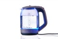 Glass electric kettle with boiling water on a white insulated background Royalty Free Stock Photo