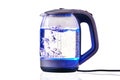 Glass electric kettle with boiling water on a white insulated background Royalty Free Stock Photo