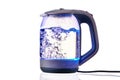 Glass electric kettle with boiling water on a white insulated background Royalty Free Stock Photo