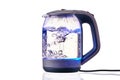 Glass electric kettle with boiling water on a white insulated background Royalty Free Stock Photo