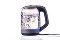 Glass electric kettle with boiling water on a white insulated background Royalty Free Stock Photo