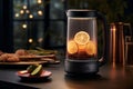 Glass electric kettle with orange slices on dark surface, aesthetic kitchen appliance for stylish home interior design