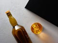 Glass of elegant whiskey with ice and whisky bottle Royalty Free Stock Photo