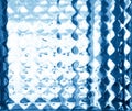 Glass embossed pattern in blue tones. Glass relief.