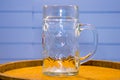 Glass empty beer glass stands on beer barrel Royalty Free Stock Photo