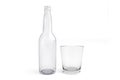 Glass empty bottle and glass on white background. Royalty Free Stock Photo