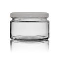 Glass empty jar for food canned closed by a white metal cover with reflection. Isolated on a white background Royalty Free Stock Photo