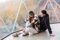 Glass-Encased Love: Couple's Autumn Affection Under a Fall Canopy