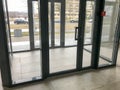 The glass entrance at the entrance to the building store office with sliding double doors Royalty Free Stock Photo