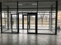 The glass entrance at the entrance to the building store office with sliding double doors Royalty Free Stock Photo