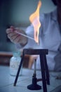 Glass equipment sterilisation in the flame of burner. Bunsen burner, tripod in the chemical laboratory