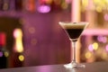 Glass of Espresso Martini on counter in bar. Alcohol cocktail Royalty Free Stock Photo