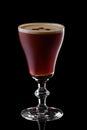 Glass of espresso martini isolated on black Royalty Free Stock Photo