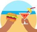 Glass with exotic cocktail and burger on tropical beach. Recreation on sea cost in sunny day
