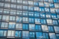 Glass Facade of Modern Building with Blue Sky Reflecting in Glass Windows Royalty Free Stock Photo