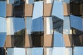 Glass faÃâÃÂ§ade in hi-tech style. Modern building with irregular geometry