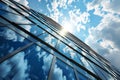 glass facade of a modern office building against a blue sky Royalty Free Stock Photo