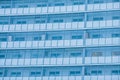 Glass facade of a residential building. Modern apartment building: glazed balconies of new apartments, construction. Royalty Free Stock Photo