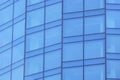 The glass facade of a skyscraper with a mirror reflection of sky windows Royalty Free Stock Photo