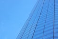 The glass facade of a skyscraper with a mirror reflection of sky windows Royalty Free Stock Photo