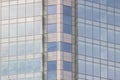 The glass facade of a skyscraper with a mirror reflection of sky windows Royalty Free Stock Photo