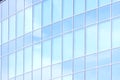 The glass facade of a skyscraper with a mirror reflection of sky windows Royalty Free Stock Photo