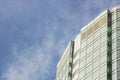 The glass facade of a skyscraper with a mirror reflection of sky windows Royalty Free Stock Photo