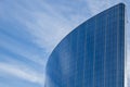 The glass facade of a skyscraper with a mirror reflection of sky windows Royalty Free Stock Photo