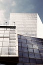 Glass facades of a skyscraper in a bright sunny day with sunbeam