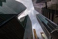 Glass Facades of skyscrapers of the financial district of Singapore on a cloudy evening, bottom view, wide lens, city Royalty Free Stock Photo