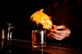 Glass of fiery cocktail on the bar counter Royalty Free Stock Photo