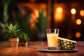 a glass filled with freshly squeezed pineapple juice set against the backdrop of a busy bar. Royalty Free Stock Photo