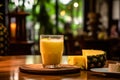 a glass filled with freshly squeezed pineapple juice set against the backdrop of a busy bar. Royalty Free Stock Photo