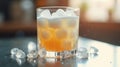 A glass filled with a frothy orange beverage surrounded by ice cubes Royalty Free Stock Photo