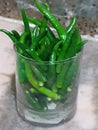 A glass filled with green chilly, a spice that adds the right dose of hotness to every menu Royalty Free Stock Photo