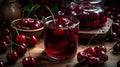 Glass filled juice and cherries, bowl overflowing with more cherrie, vibrant red fruit Royalty Free Stock Photo