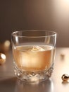 a glass filled with liquid next to a golden egg, whiskey glass with ice cubes. Royalty Free Stock Photo