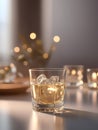 a glass filled with liquid next to a golden egg, whiskey glass with ice cubes. Royalty Free Stock Photo