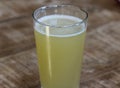 glass filled with radler, mixture of beer and sparkling lemonade, on wooden background Royalty Free Stock Photo