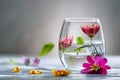 Glass Filled With Water and Floating Flowers Royalty Free Stock Photo