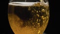 Glass filling with golden beer Royalty Free Stock Photo